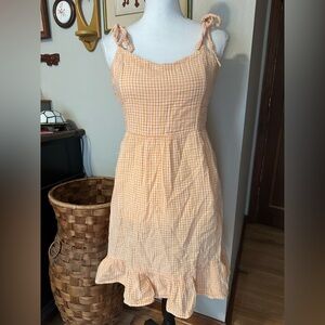 Old Navy orange gingham dress with ruffle hem and tie straps